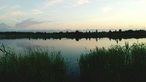 Scenic view of lake at sunset