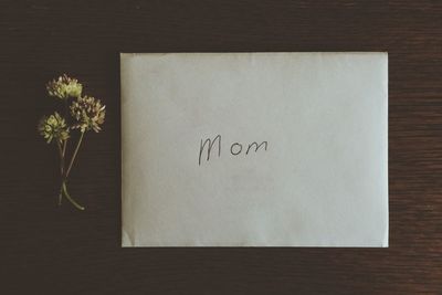 Close-up of greeting card for mom on table
