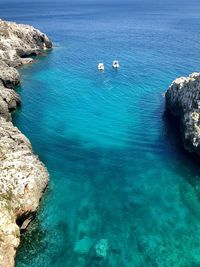 High angle view of rocks in sea