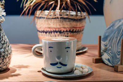 Close-up of coffee cup on table