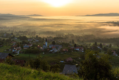 High angle view of townscape against sky at sunset