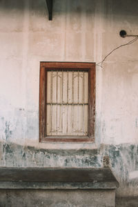 Low angle view of window on old building