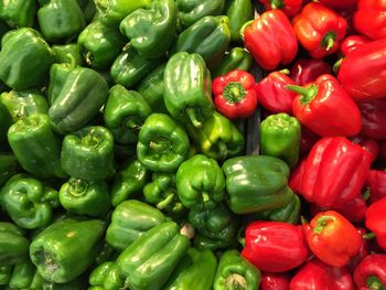 High angle view of multi colored bell peppers for sale in supermarket