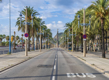 The paseo de colon in barcelona and with the montjuic mountain in the distance