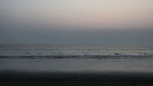 Scenic view of sea against sky at sunset