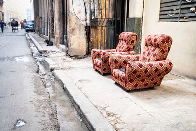 Two red armchairs on the street in havana, cuba