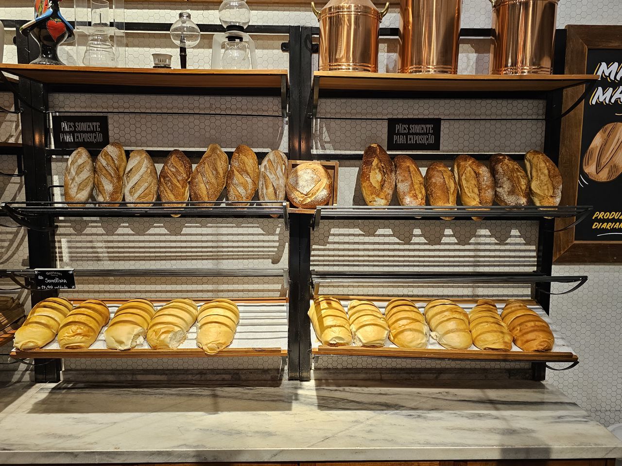 bakery, food and drink, food, store, shelf, baker, baked, bread, retail, indoors, freshness, business, no people, fast food, variation, business finance and industry, pâtisserie, meal, in a row, french food, large group of objects, abundance, small business, arrangement, loaf of bread