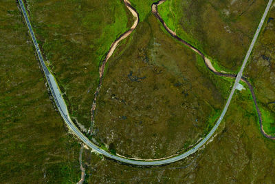 Beautiful scenery mountain road , cliff, cloud and lush grass in isle of skye, scotland, uk.