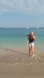 Young woman standing on beach