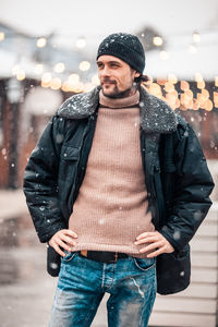 Man in city during snowfall