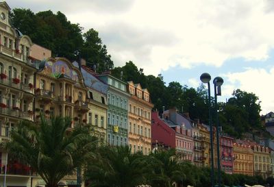 Buildings against cloudy sky