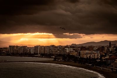 View of buildings against sky during sunset