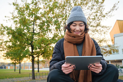 Young woman using digital tablet