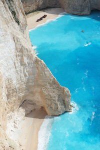 High angle view of rocks by sea