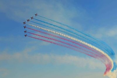 Low angle view of airplane flying in sky