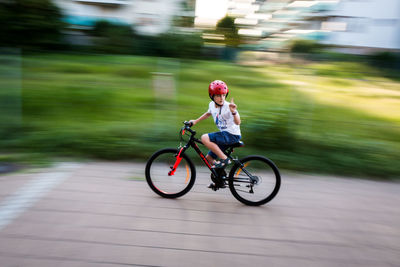 Man riding bicycle on road