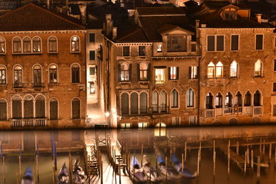 Reflection of buildings in city at night