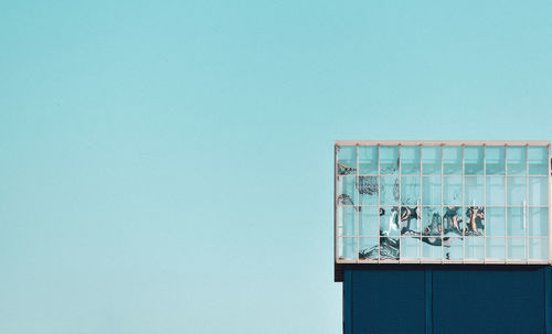 Low angle view of building against clear blue sky