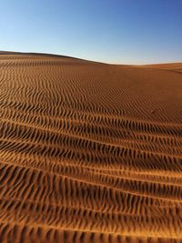 Scenic view of desert against clear sky