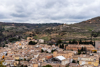 High angle view of townscape against cloudy sky