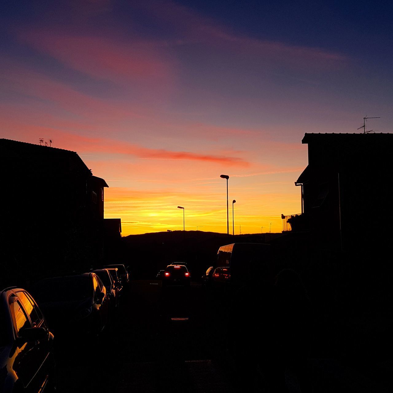 SILHOUETTE CITY BUILDINGS AGAINST SKY DURING SUNSET