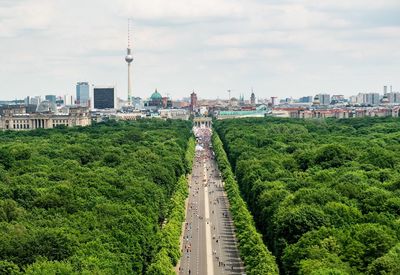 Panoramic view of city against cloudy sky