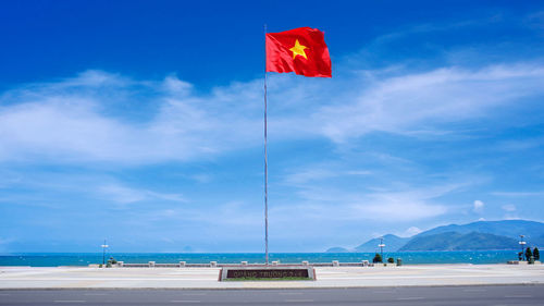  quang truong square, april 2 square, national vietnamese flag on a flagpole. nha trang, vietnam