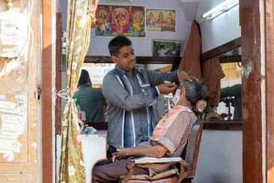 Men sitting in traditional clothing