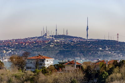 Behind the bridge mosque and television broadcast tower