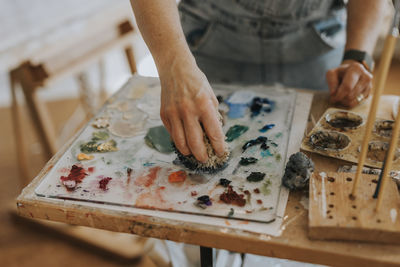 Artist painting in studio