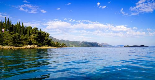 Scenic view of sea against cloudy sky