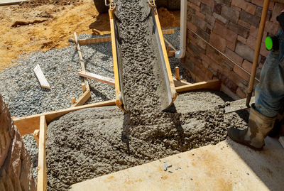 Low section of man working at construction site