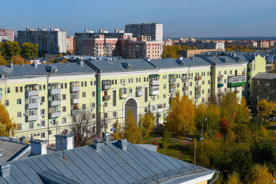 High angle view of trees and buildings against sky