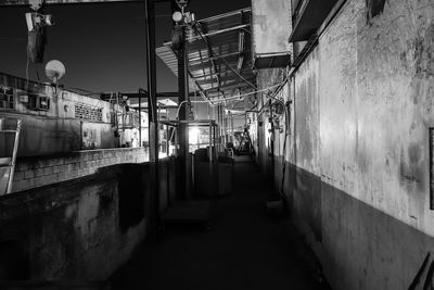 Empty alley amidst buildings