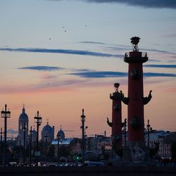 View of illuminated building against sky during sunset