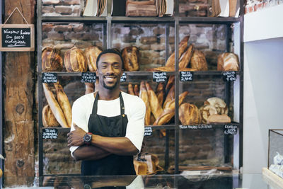 African man working in bread pastry.