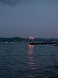 Scenic view of sea against sky at dusk