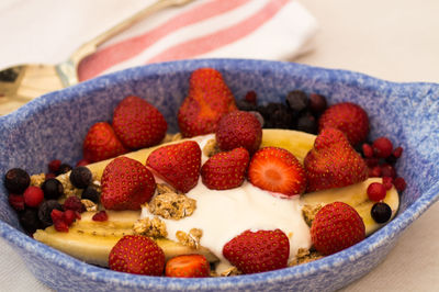 Close-up of strawberries with banana on table