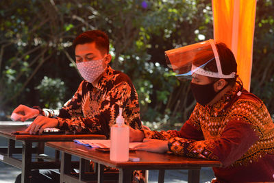 Men sitting on table