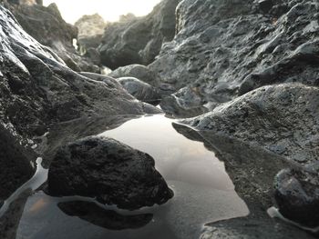 Close-up of rocks in mountains against sky