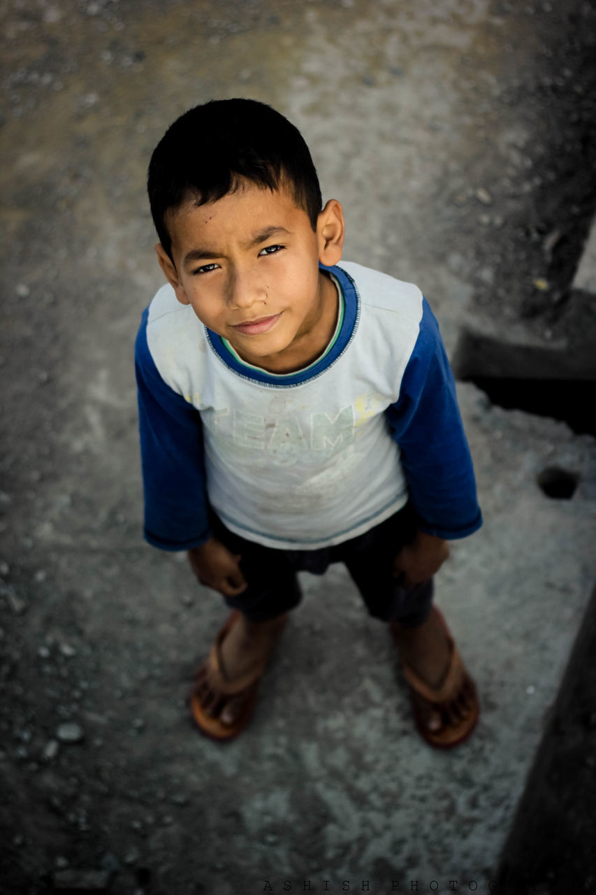 HIGH ANGLE PORTRAIT OF CUTE BOY