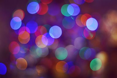 Illuminated defocused christmas lights at night