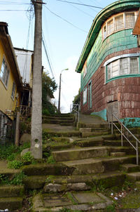 Abandoned staircase against clear sky