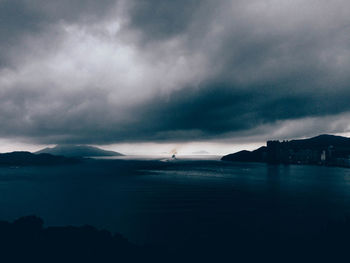 View of calm sea against cloudy sky