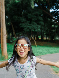 Portrait of laughing girl at park