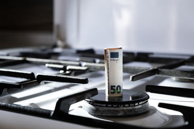 Close-up of currency on gas burner