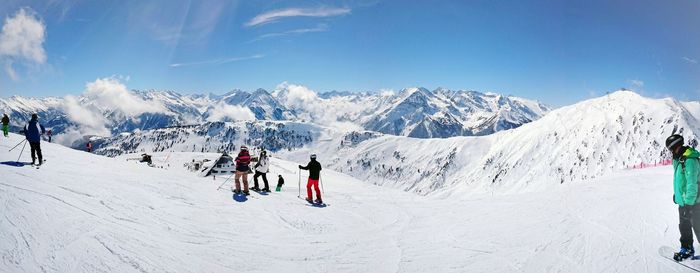 Tourists on snow covered landscape