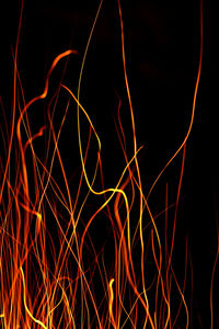 Close-up of light trails against black background