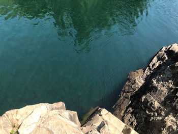 High angle view of rock formation in lake