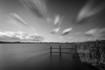 Scenic view of landscape against cloudy sky